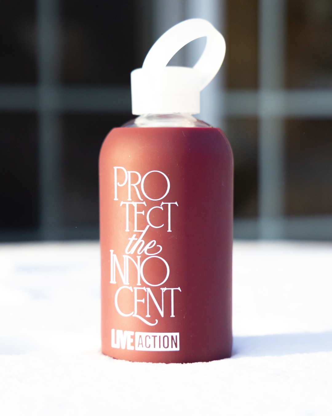 Protect The Innocent Glass Water Bottle