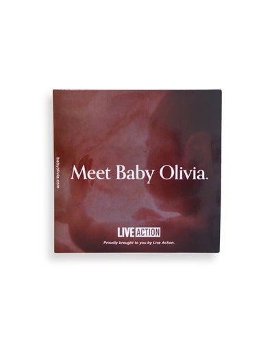 The cover of the Baby Olivia dvd features the back/side profile of a baby in utero looking out at the world through the point of view of a preborn child. Across the center is the text "Meet Baby Olivia." in white font.
